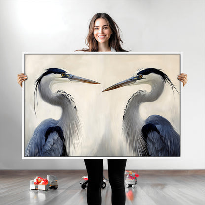 Two blue herons facing each other on a soft neutral background, ideal for coastal, tranquil, or nature-inspired minimalist interiors.