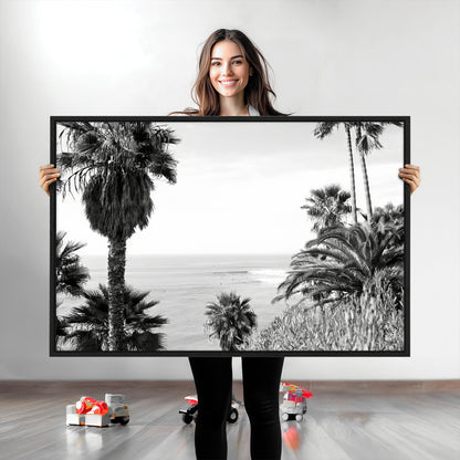 Monochrome canvas of palm trees framing a coastal surf scene, perfect for California-inspired or retro black-and-white beach decor.