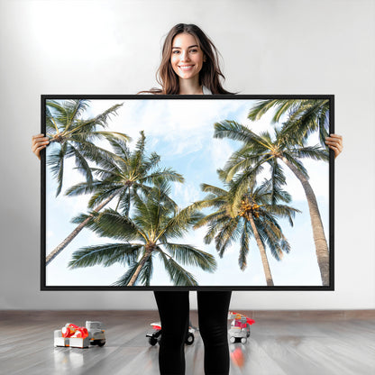 Framed canvas of tall palm trees reaching into a tropical sky, ideal for beach home or relaxed island-inspired wall decor.