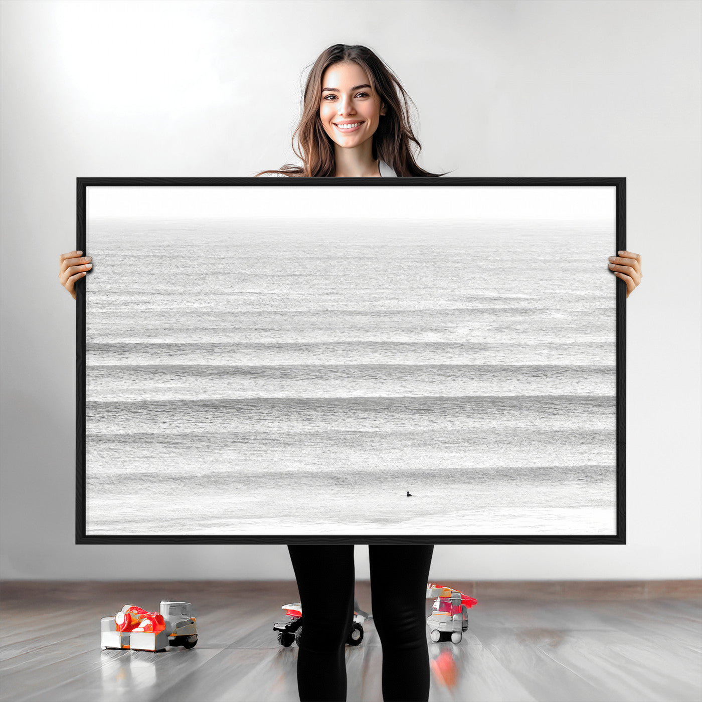 Monochrome photo of a lone surfer in calm layered waves, perfect for minimalist coastal or moody ocean-inspired wall decoration.