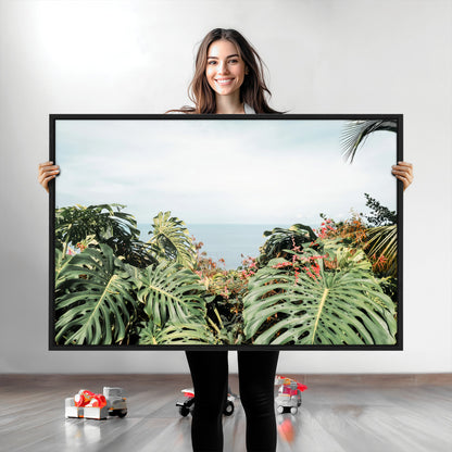 Monstera leaves and tropical flowers framing a calm ocean view, ideal for tropical coastal or exotic jungle-style interior wall decor.