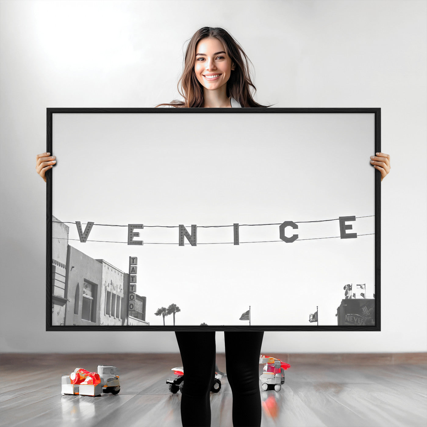 Black and white photo of Venice Beach sign and palm-lined street, perfect for urban coastal or minimalist LA-inspired wall decoration.