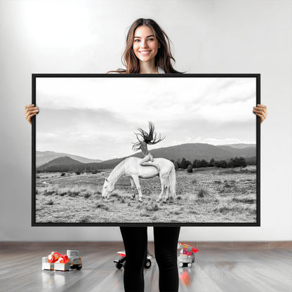 Black and white photo of a woman on a white horse in moody tones, ideal for Western Boho or modern rustic-style home decor.