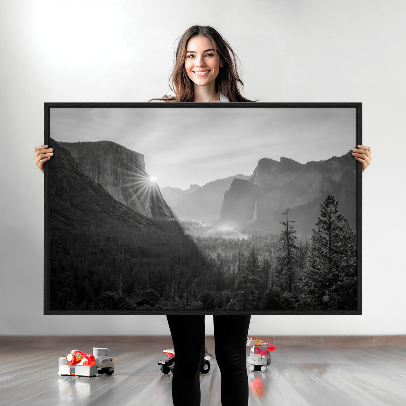Black and white landscape of Yosemite with sun rays peeking over El Capitan, ideal for moody nature or modern rustic decor.