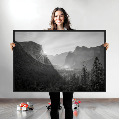Black and white landscape of Yosemite with sun rays peeking over El Capitan, ideal for moody nature or modern rustic decor.