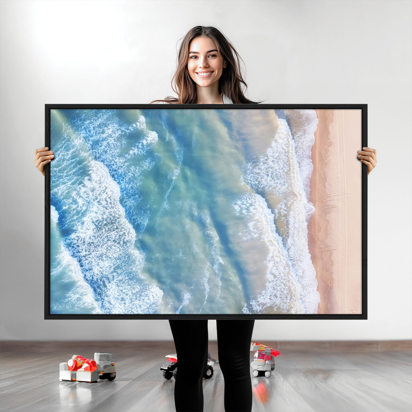 Aerial photo of soft blue waves meeting sandy shore, perfect for modern coastal or beach-themed decor with a light and tranquil aesthetic.
