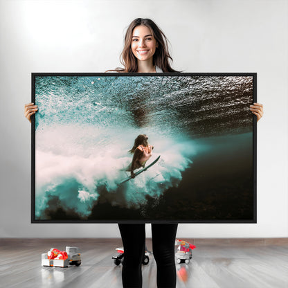 Vibrant underwater photo of a female surfer diving through turquoise waves, perfect for coastal boho or surf-inspired home decor.