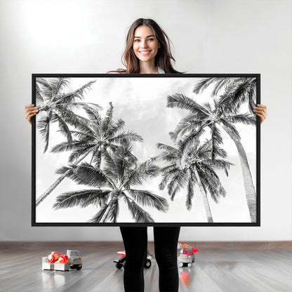 Black and white tropical palm trees viewed from below, swaying gently against a bright sky, creating a serene and elegant coastal atmosphere.