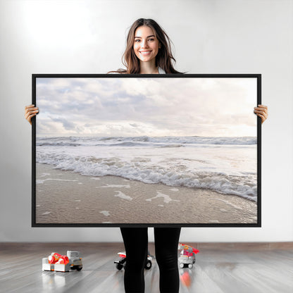 Peaceful ocean waves rolling onto the sandy shore under soft light, perfect for neutral or coastal minimalist decor themes.