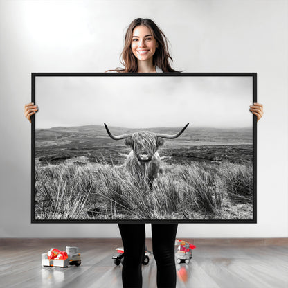 A black and white portrait of a Highland cow in a foggy Scottish countryside, capturing a rustic aesthetic and tranquil farm escape.