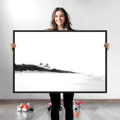 A black and white minimalist coastal scene with a vast open beach, distant palm trees, and a lone figure walking along the shoreline, evoking serenity and solitude.