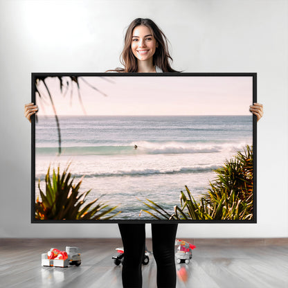 Canvas of a lone surfer riding a pastel wave at sunrise, perfect for tropical or coastal-themed spaces with a relaxed, airy vibe.