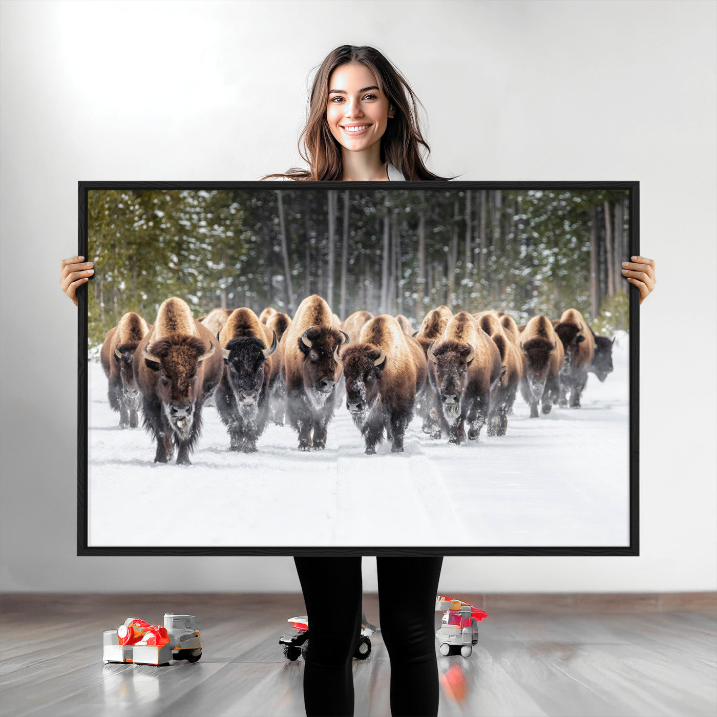 A herd of American bisons walking through a snowy forest path, perfect for rustic cabin or Western-themed wall decor.