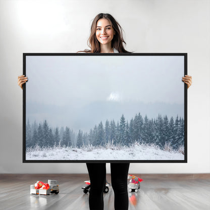 Snow-covered forest under misty sky, soft light breaking through clouds, ideal for minimalist or Nordic-inspired home decor.