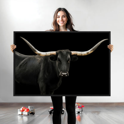 Close-up of a black Texas longhorn with large curved horns on black background, ideal for rustic farmhouse or modern western interiors.