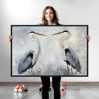 Two herons facing each other on a soft-toned background with blue-grey feathers, perfect for tranquil, coastal or nature-themed interiors.