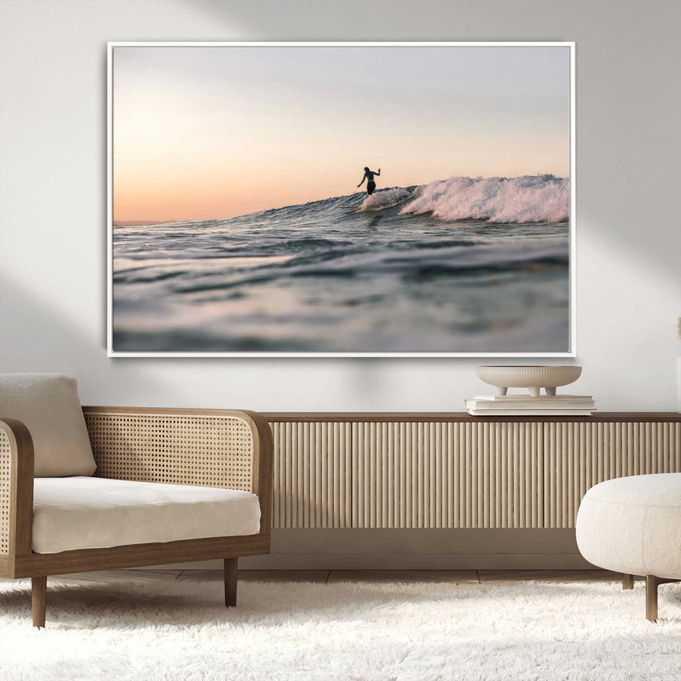Framed canvas of a female surfer balancing on a wave at sunset, perfect for serene surf or ocean-inspired coastal decor.