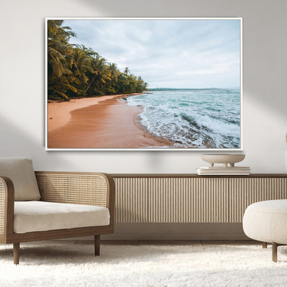 Framed canvas of a tropical beach with palm trees and soft waves, ideal for coastal escape or serene nature-inspired home decor.