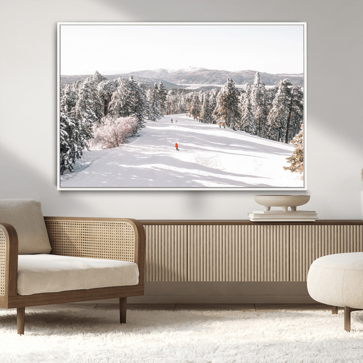 Bright ski trail lined with snow-covered pines and a skier in orange, perfect for alpine adventure or winter sports-inspired decor.