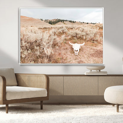 Rustic bull skull on dry sagebrush field under soft light, ideal for western minimal or desert prairie-style wall decoration.