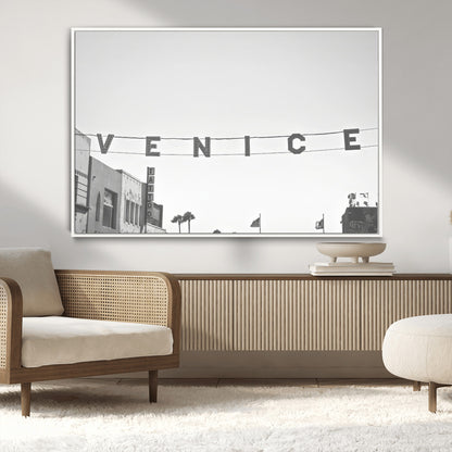 Black and white photo of Venice Beach sign and palm-lined street, perfect for urban coastal or minimalist LA-inspired wall decoration.