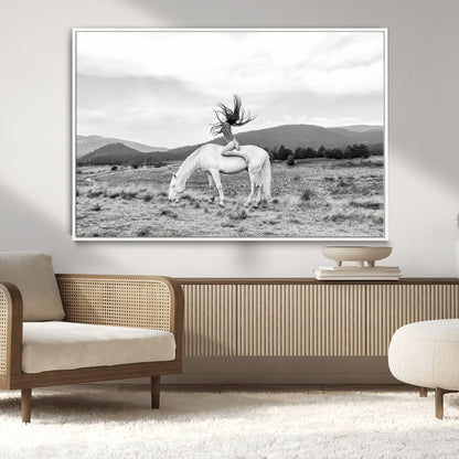 Black and white photo of a woman on a white horse in moody tones, ideal for Western Boho or modern rustic-style home decor.