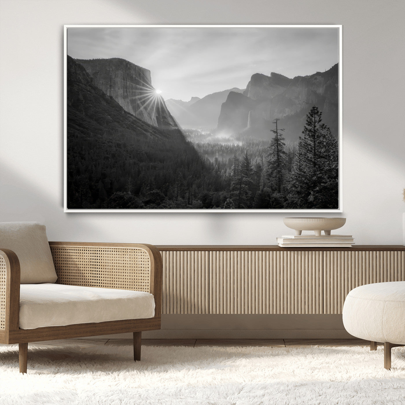 Black and white landscape of Yosemite with sun rays peeking over El Capitan, ideal for moody nature or modern rustic decor.