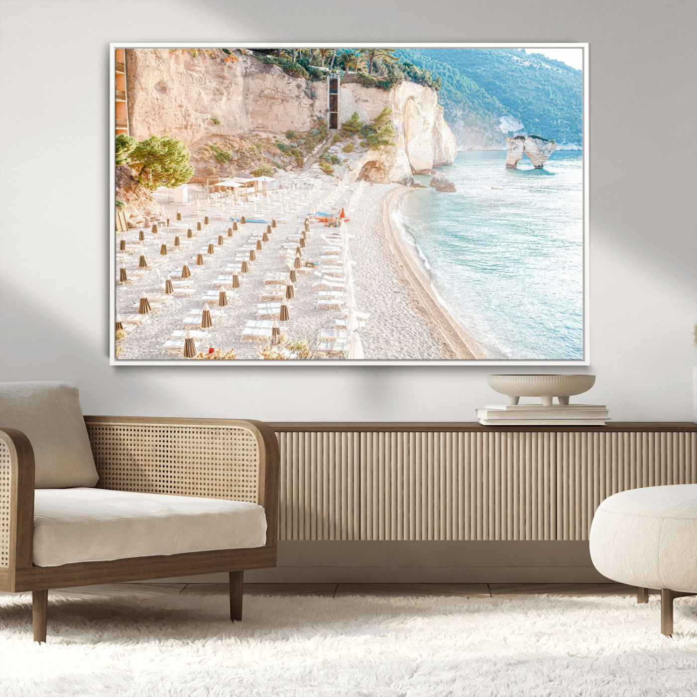 Wall art of a calm Mediterranean beach with rows of sun loungers and umbrellas in soft pastel tones, perfect for light coastal or vacation-themed decor.