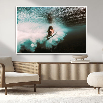 Vibrant underwater photo of a female surfer diving through turquoise waves, perfect for coastal boho or surf-inspired home decor.