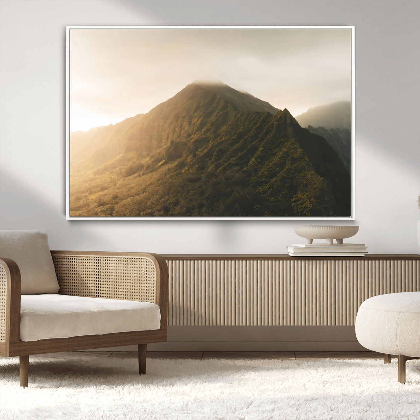Sunlit mountain peak with mist rolling over its rugged slopes, bathed in golden light, creating a warm and tranquil nature-inspired scene.