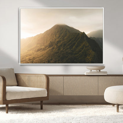Sunlit mountain peak with mist rolling over its rugged slopes, bathed in golden light, creating a warm and tranquil nature-inspired scene.