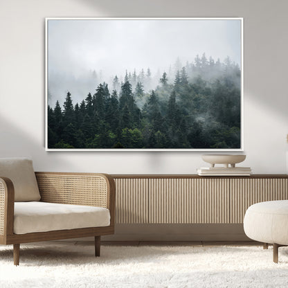 A misty evergreen forest shrouded in soft fog, creating a tranquil and moody landscape with lush green trees fading into the distance.