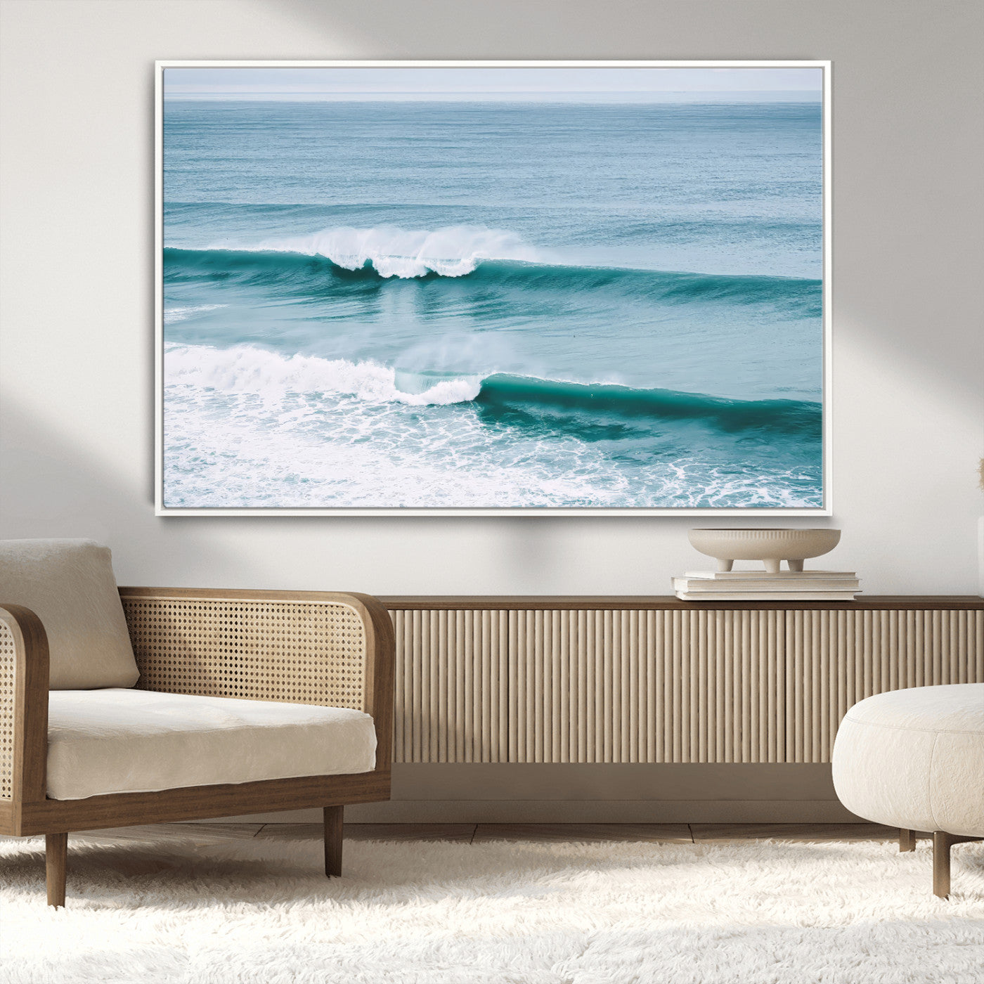 Powerful ocean waves rolling towards the shore, their turquoise hues blending with white sea foam under an open horizon, capturing the essence of the ocean's movement.