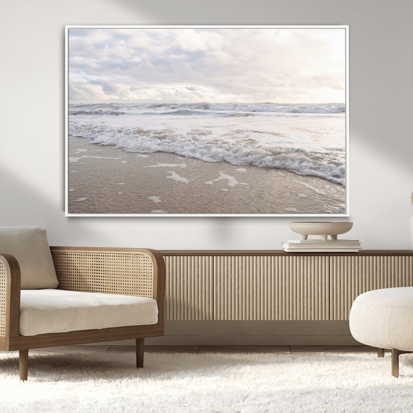 Peaceful ocean waves rolling onto the sandy shore under soft light, perfect for neutral or coastal minimalist decor themes.