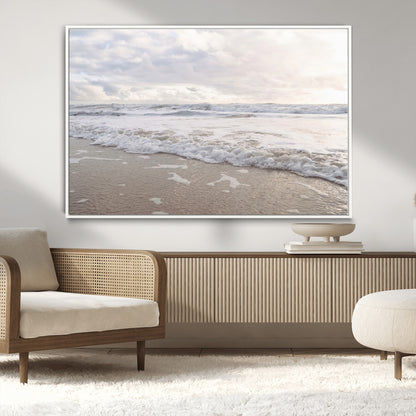 Peaceful ocean waves rolling onto the sandy shore under soft light, perfect for neutral or coastal minimalist decor themes.
