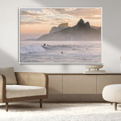 A surfer rides a golden hour wave near misty coastal mountains, surrounded by fellow surfers, capturing the spirit of a coastal adventure.