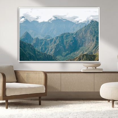 A misty mountain landscape with cloud-covered Andean peaks and lush green valleys, creating a dramatic and serene view, perfect for rustic or nature-inspired home decor.
