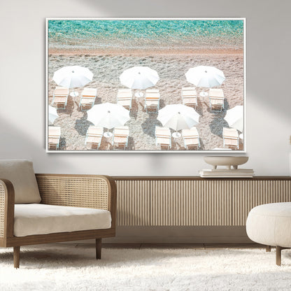 A bright beach scene with white umbrellas, pastel sand, and turquoise waters, creating a tranquil coastal vibe, perfect for beach house or summer decor.