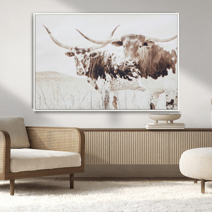 Two longhorn cows standing in a sepia-toned pasture with soft light, ideal for rustic or farmhouse-themed neutral wall decor.