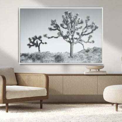 Black and white Joshua tree in a desert landscape with soft light and dry brush, perfect for rustic or minimalist home decor.