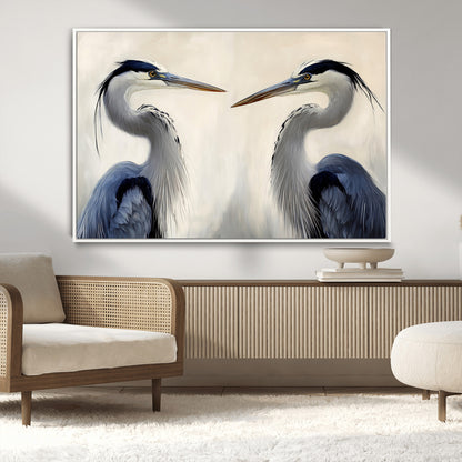 Two blue herons facing each other on a soft neutral background, ideal for coastal, tranquil, or nature-inspired minimalist interiors.