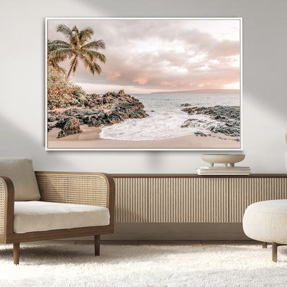 A peaceful beach scene with a palm tree and rocks, soft waves washing onto the shore under a soft pastel sky at sunset.