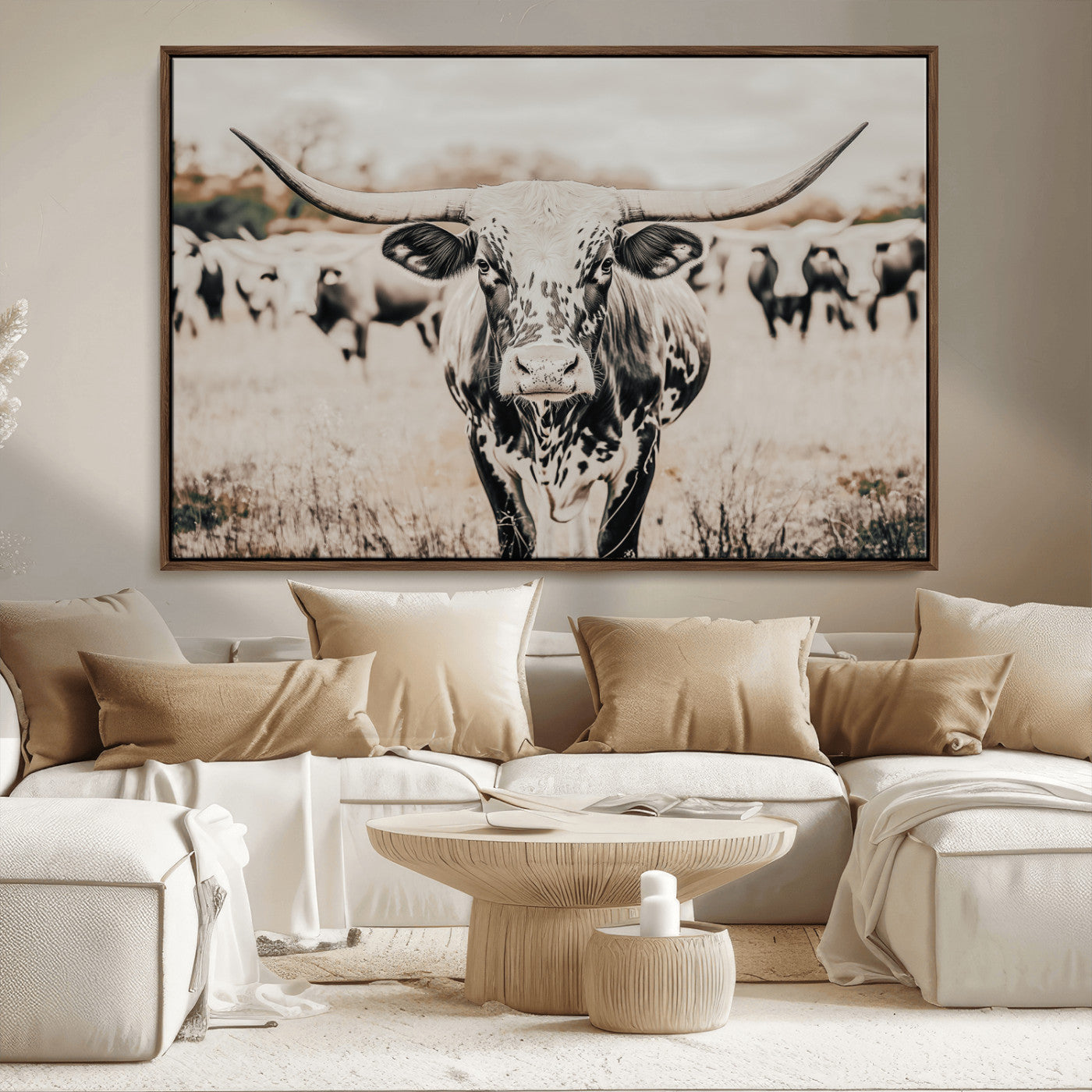 Canvas of a speckled Texas longhorn standing boldly in a field with a herd behind, perfect for rustic western or farmhouse wall decor.
