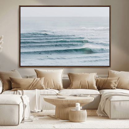 High-angle view of surfers lining up across layered ocean waves, ideal for minimal coastal or surf-inspired room decor.