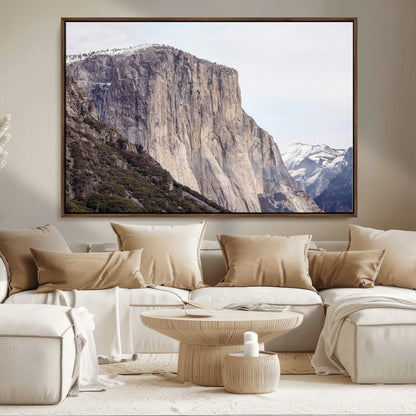 Framed canvas of El Capitan’s vertical granite face in Yosemite with snowy peaks, ideal for Sierra minimalism or mountain-inspired decor.