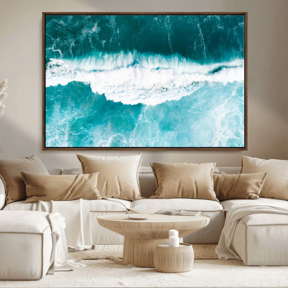 Aerial view of turquoise ocean waves crashing with white foam, perfect for tropical coastal or modern beach-style home decor.