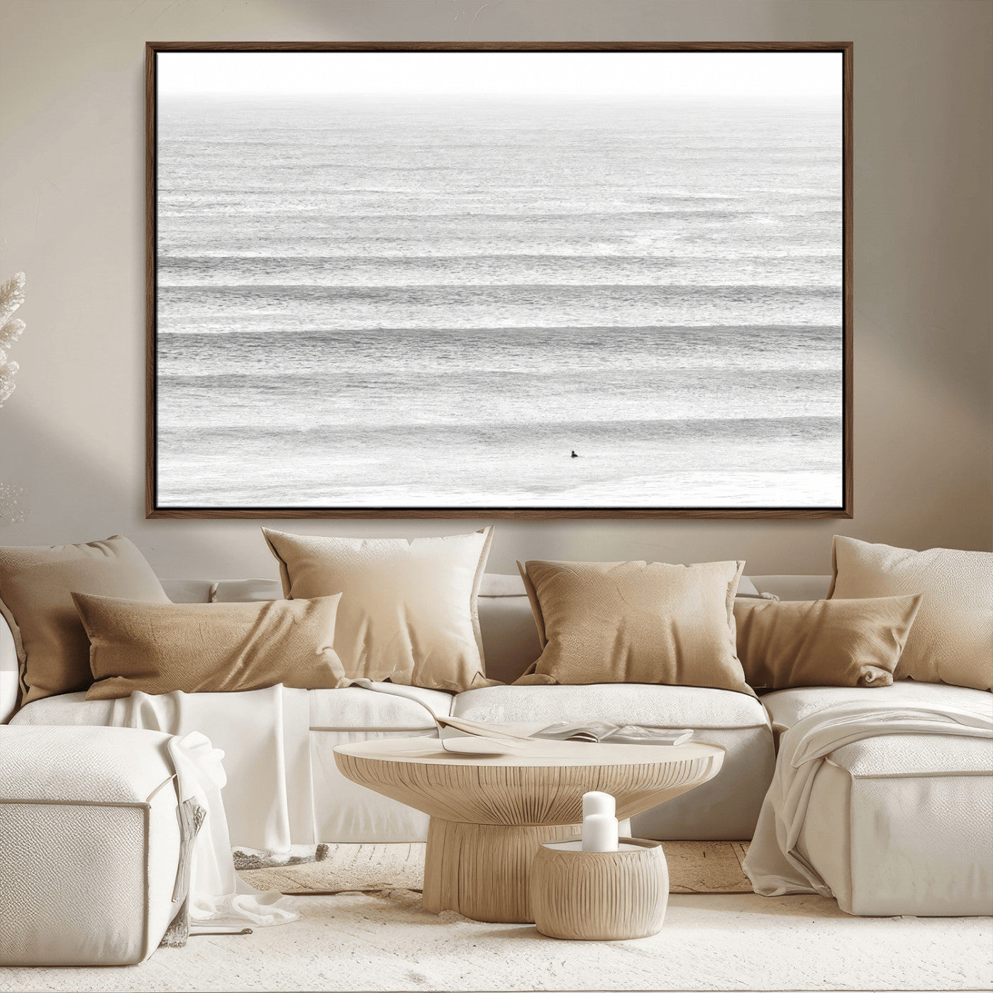 Monochrome photo of a lone surfer in calm layered waves, perfect for minimalist coastal or moody ocean-inspired wall decoration.