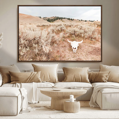 Rustic bull skull on dry sagebrush field under soft light, ideal for western minimal or desert prairie-style wall decoration.