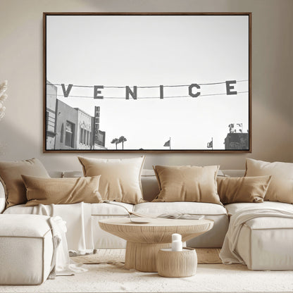 Black and white photo of Venice Beach sign and palm-lined street, perfect for urban coastal or minimalist LA-inspired wall decoration.