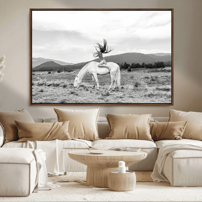 Black and white photo of a woman on a white horse in moody tones, ideal for Western Boho or modern rustic-style home decor.